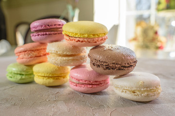 Macarons on a concrete background. Isolates. Multi-colored. Beautiful background.
