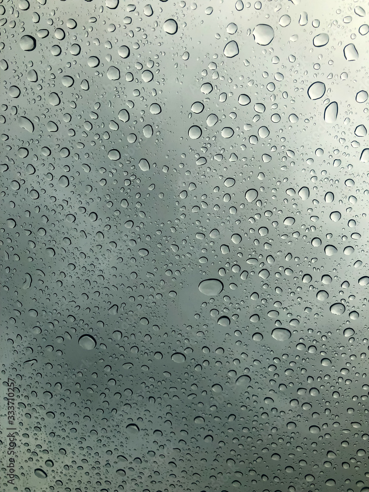 Poster water drop on the clear glass. fogged misted window with rain drops. abstract background.