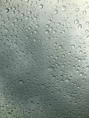 Water drop on the clear glass. fogged misted window with rain drops. Abstract background.