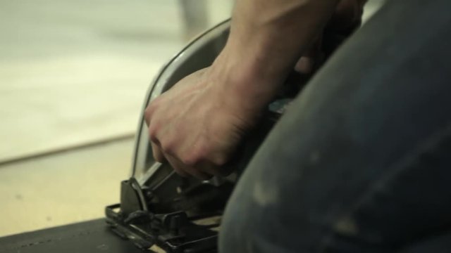 Worker cutting wooden with woden cuter. Close up shoting