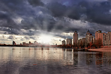 Naklejka premium Obolon embankment in the autumn, Kyiv, Ukraine. Sun rays