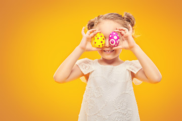 positive girl with painted eggs