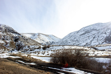 Caucasus Mountains in winter. Landscape of the rocky Caucasus mountains in winter. Landscape of the rocky Caucasus mountains against the sky. Rocky mountains in winter. mountains in winter