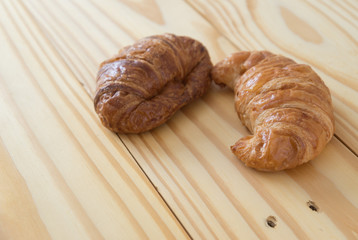 Croissant bakery on the wooden table
