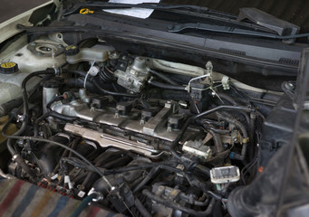 Fototapeta na wymiar Vehicle engine repairing in the garage