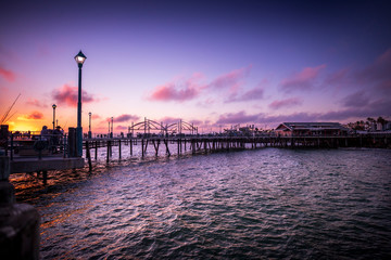 Fototapeta na wymiar A dramatic sunset over the pier in Redondo Beach, California.
