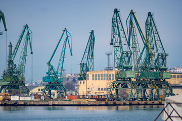 Fototapeta na wymiar Cranes in a shipyard used for wheat and coal shipping