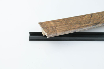 Interior threshold. A joint connecting floor coverings. without visible mounts.