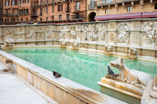 Fonte Gaia monumental fountain at the Piazza del Campo square in Siena city, Tuscany, Italy.  built in 1419
