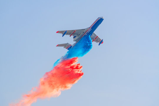 ZHUKOVSKY, RUSSIA - SEPTEMBER 01, 2019: Beriev Be-200 Flying aerial firefighting pour water over the fire for a demo flight