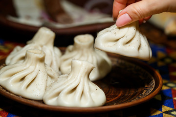 Georgian national dish Khinkali. Laid on a clay plate