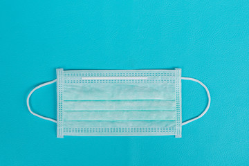 Surgical mask to cover the mouth and nose for prevention on blue background
