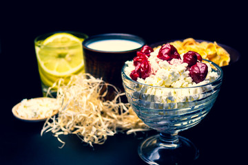 Dairy products and a glass of water with lemon