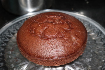 yummy and tasty home made chocolate cake garnished with dry fruits, stay home and make tasty recepies at home.