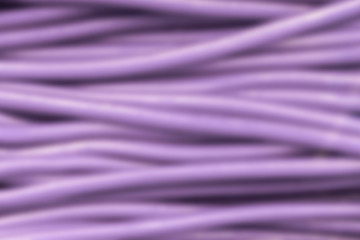 Obraz premium abstract background of lines or stems that look like wires, violet color, blur