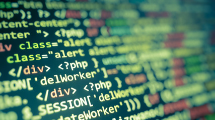 Green abstract code on monitor. Software development background concept.