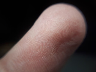 Fototapeta premium fingerprint leaning on control glass for biometric scan. concept of surveillance and security through human fingerprints