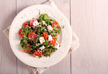 Tomato, feta, rocket and seed salad