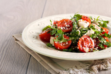 Tomato, feta, rocket and seed salad