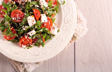 Tomato, feta, rocket and seed salad