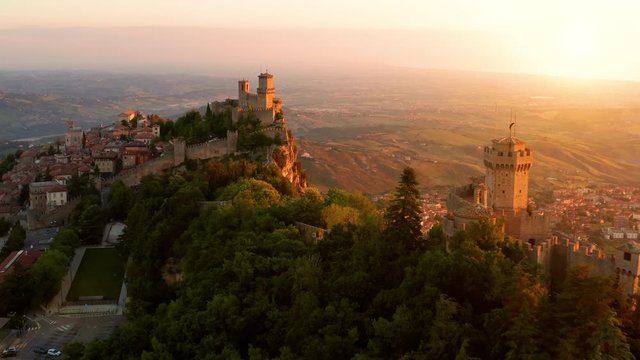 Flying over the amazing hilltop fortresses on Monte Titano in San Marino. San Marino one of the smallest countries in the world and completely surrounded by Italy.