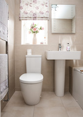 Naklejka na ściany i meble A clean, tiled home interior bathroom