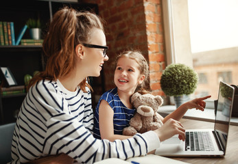 Mother and daughter working on freelance project together