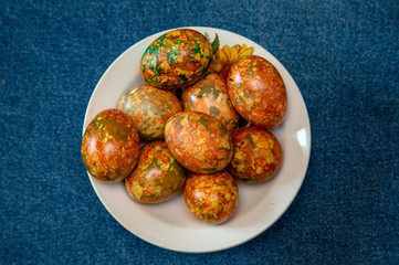 multi-colored easter eggs on a plate