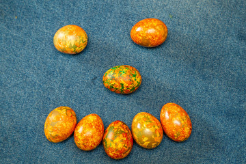 smiley of easter eggs on a blue background