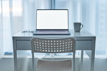 Computer on a white desk on an empty working place. Online smart digital remote work at home. Mockup