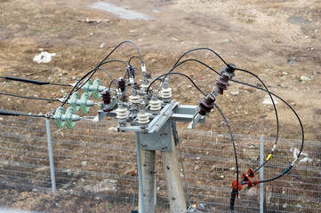 Power cables on a concrete pole with power distribution. The view from the top. Background