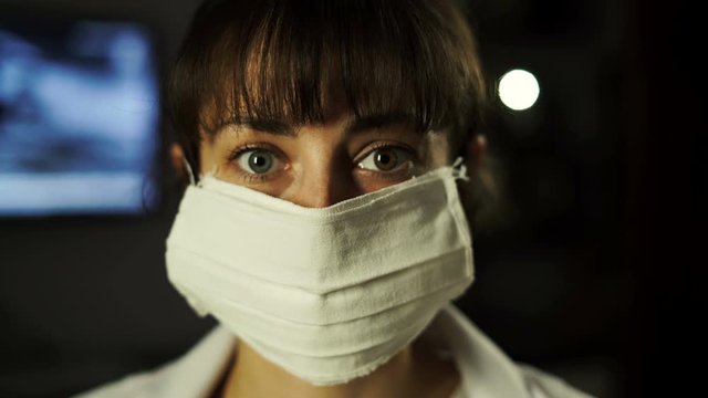 Young woman takes on medical masks. Concept of health and safety life, coronavirus, super virus protection, pandemic