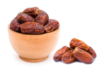 dates  fruit in wooden bowl isolated on white background. 