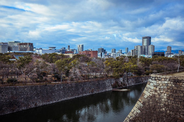 Fototapeta na wymiar Osaka, Japan - January 07, 2020: Panoramic View to the Evening City from the Castle Roof