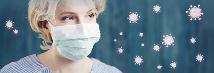 young woman in medical face protection mask indoors on blue background