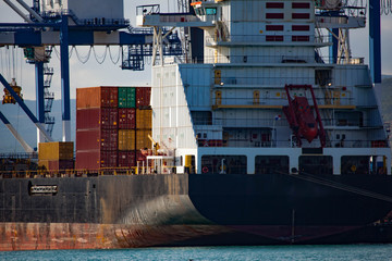 Cargo ship with containers in seaport