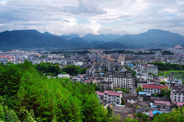 city of Lishui China and mountain landscape and apartment buildings