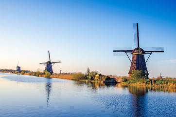 breathtaking beautiful inspirational landscape with windmills in Kinderdijk, Netherlands. Fascinating places, tourist attraction.