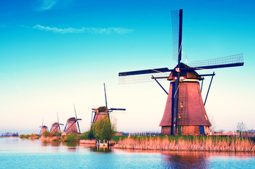 breathtaking beautiful inspirational landscape with windmills in Kinderdijk, Netherlands. Fascinating places, tourist attraction.