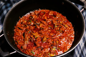 kerala style spicy and hot beef curry in a cooking pot