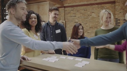 Group meeting and talking at networking event