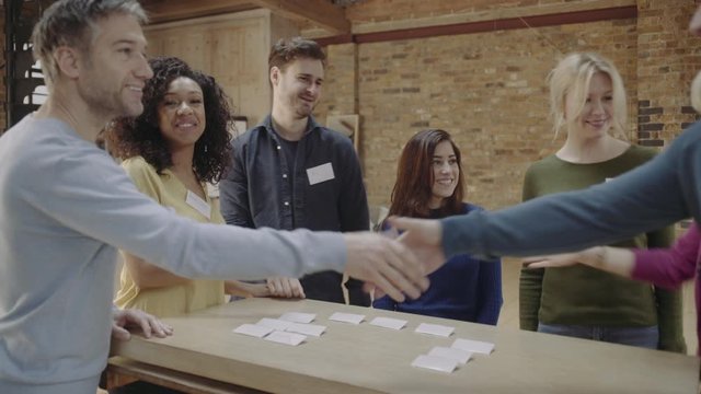 Group meeting and talking at networking event