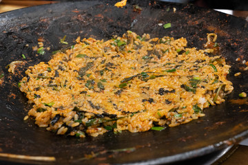 Korean style hot pot spicy fried rice with seaweed and vegetables.