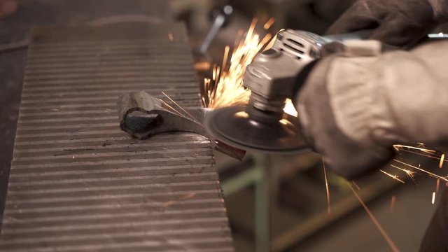 Blacksmith sharpening axe