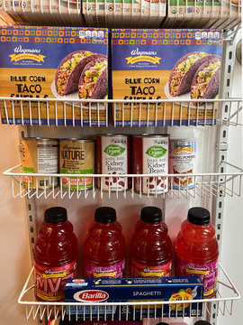 WOODBRIDGE, NEW JERSEY / USA - March 28, 2020: Dried and shelf stable food items are stored in a residential pantry, in preparation for potential Coronavirus quarantine in this illustrative editorial 