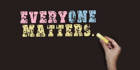 Everyone Matters words written on blackboard. Inclusion diversity equality concept