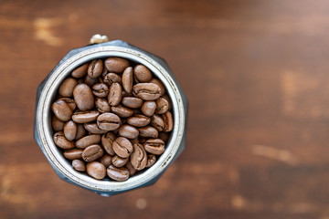 Roasted coffee beans in the glass mug