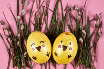 colorful easter eggs on pink background