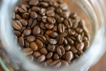 Roasted coffee beans in the glass mug