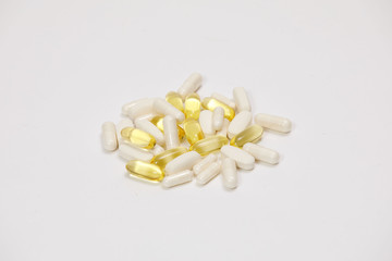 pills and vitamins on a white background